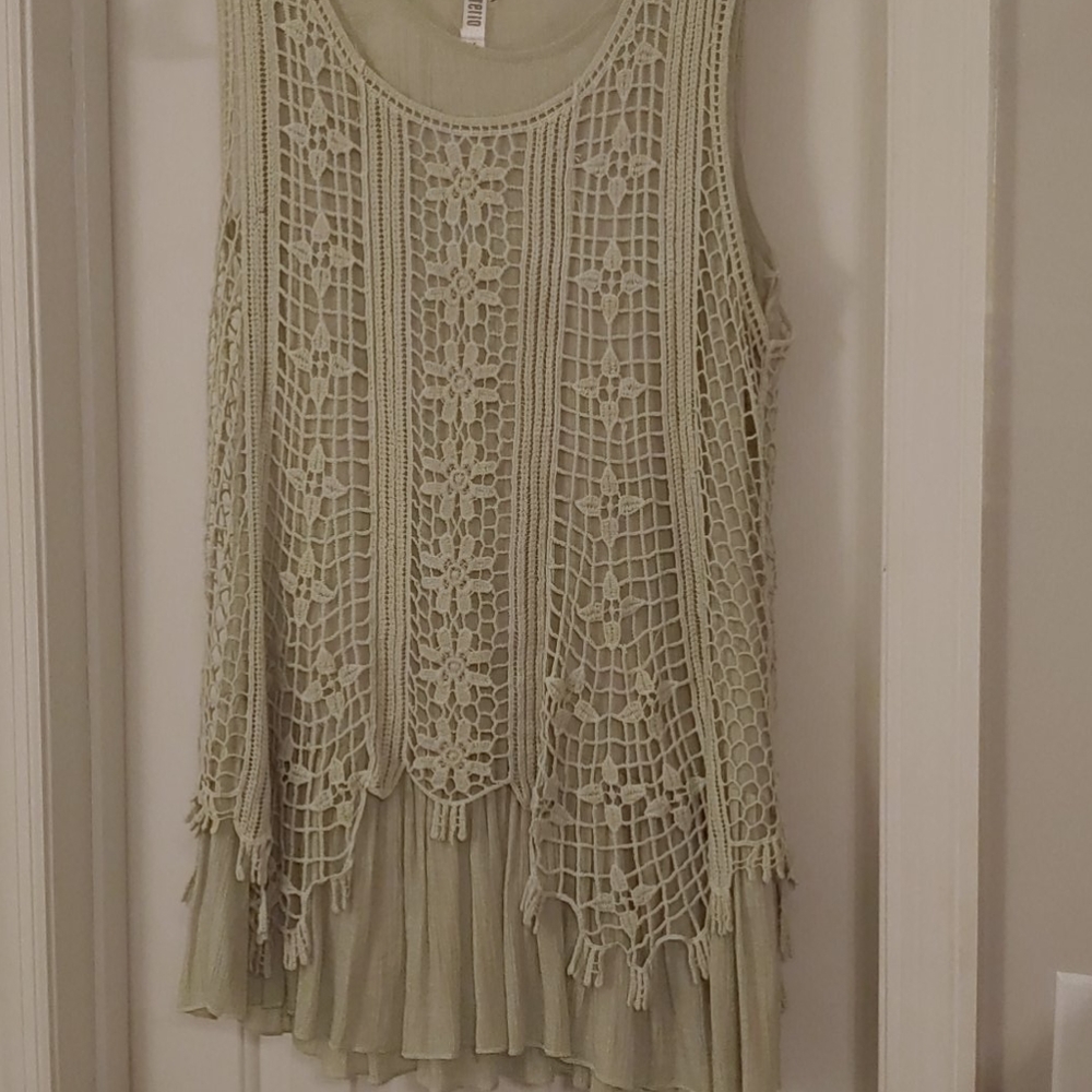 Boutique style sleeveless shirt .